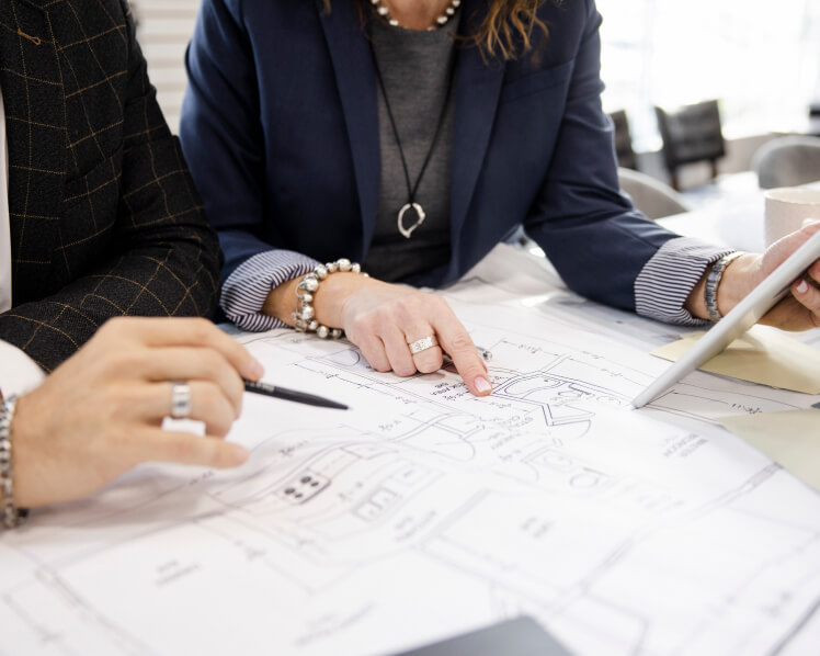 Our Process 1 Calgary design professionals collaborating on kitchen renovation project plans and ideas.